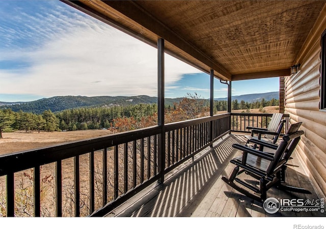 580 Saddle Notch Rd, Loveland, CO 80537 - wooden terrace with a mountain view