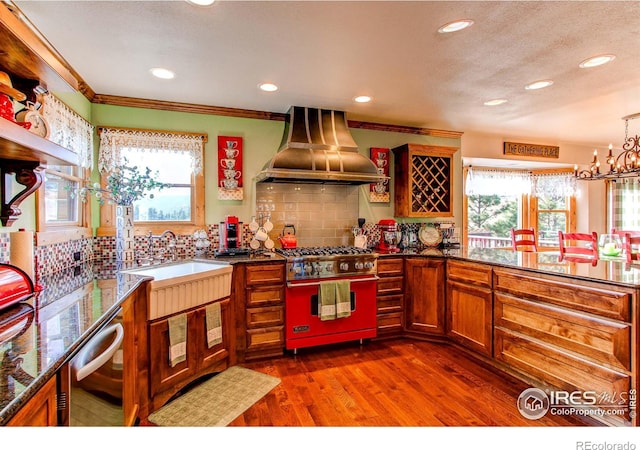 580 Saddle Notch Rd, Loveland, CO 80537 - kitchen featuring stainless steel appliances, island exhaust hood, recessed lighting, a sink, and backsplash