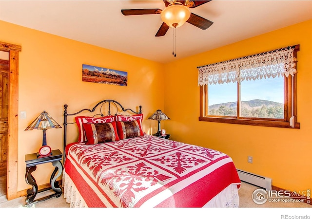 580 Saddle Notch Rd, Loveland, CO 80537 - carpeted bedroom with baseboard heating, baseboards, and ceiling fan