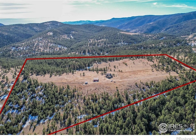 580 Saddle Notch Rd, Loveland, CO 80537 - aerial overview of property's location with a mountain backdrop and property parcel outlined