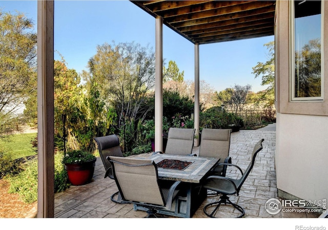 view of patio / terrace featuring an outdoor fire pit