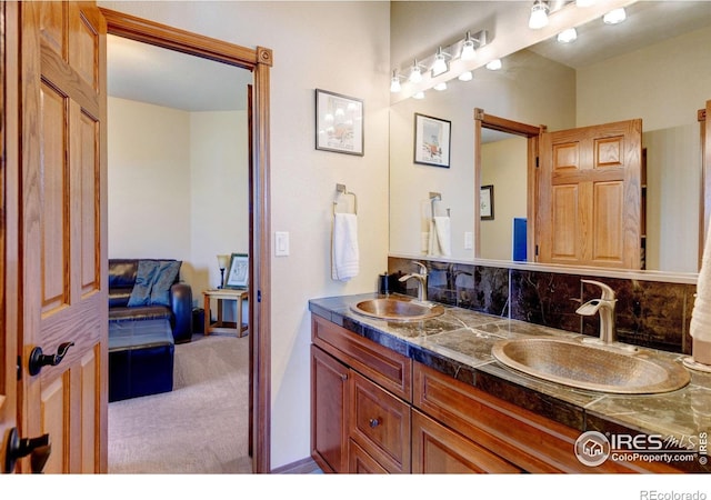 bathroom with decorative backsplash and vanity