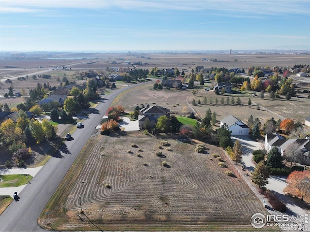 birds eye view of property with a rural view