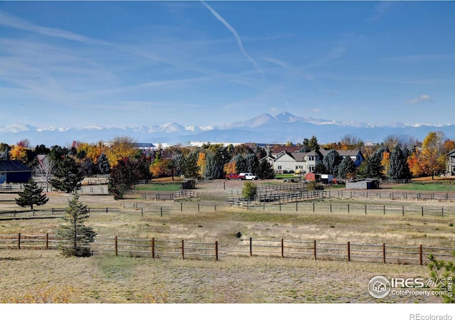 view of yard featuring a mountain view and a rural view