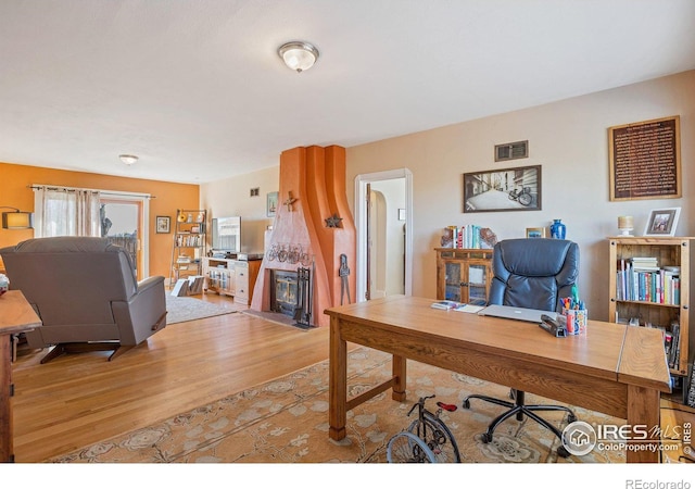 office with light hardwood / wood-style flooring