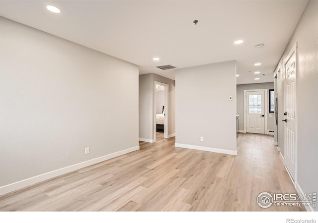 spare room with light wood-type flooring