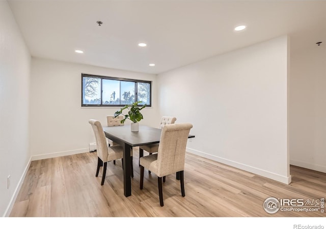 dining area featuring light wood-type flooring