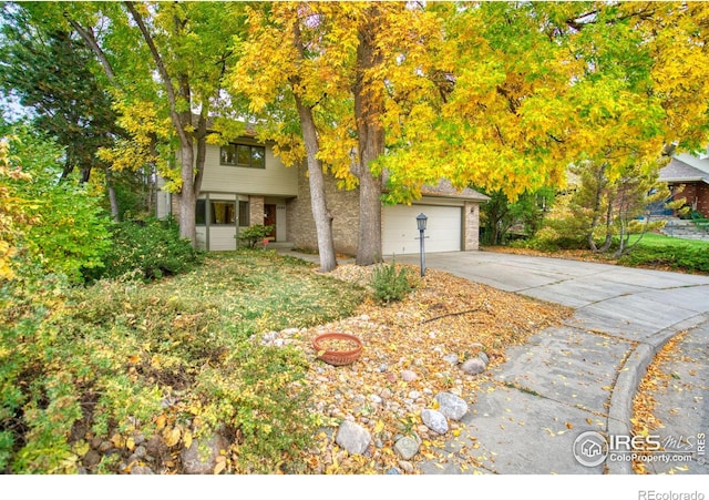 obstructed view of property featuring a garage