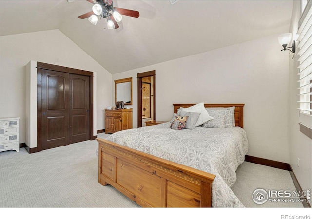 bedroom with ceiling fan, light colored carpet, and lofted ceiling