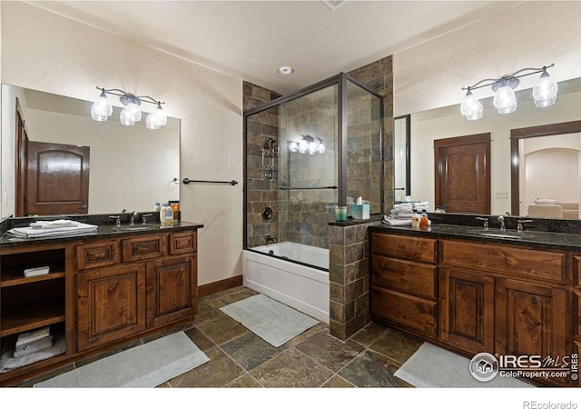 bathroom with vanity and enclosed tub / shower combo