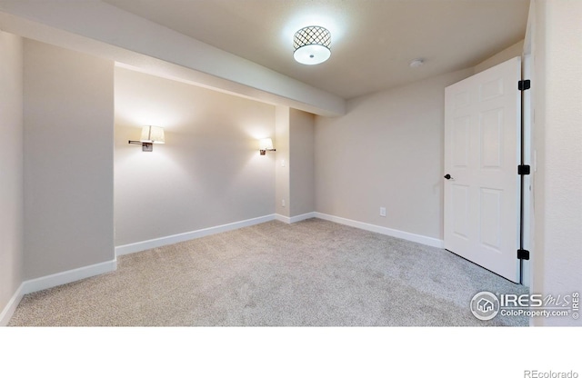 unfurnished room with light colored carpet