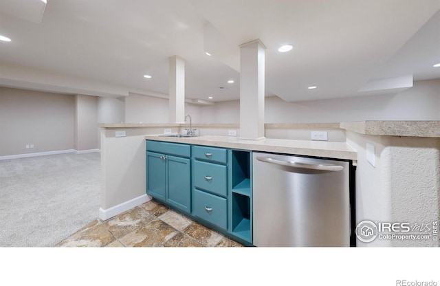 kitchen featuring dishwasher, sink, blue cabinets, kitchen peninsula, and light colored carpet