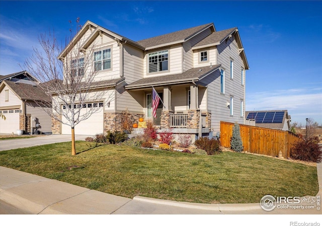 craftsman inspired home with a garage, covered porch, and a front yard