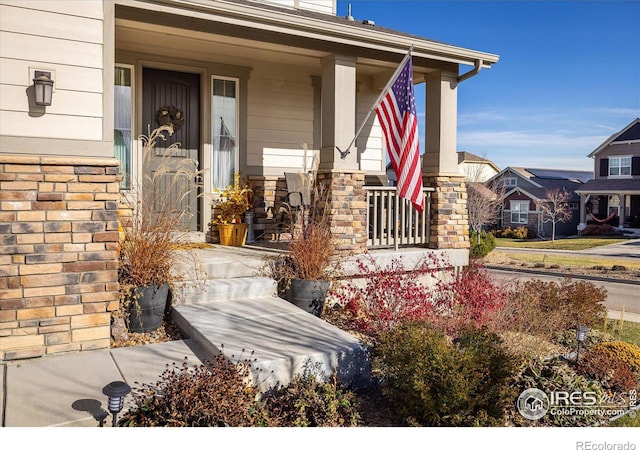 doorway to property featuring covered porch