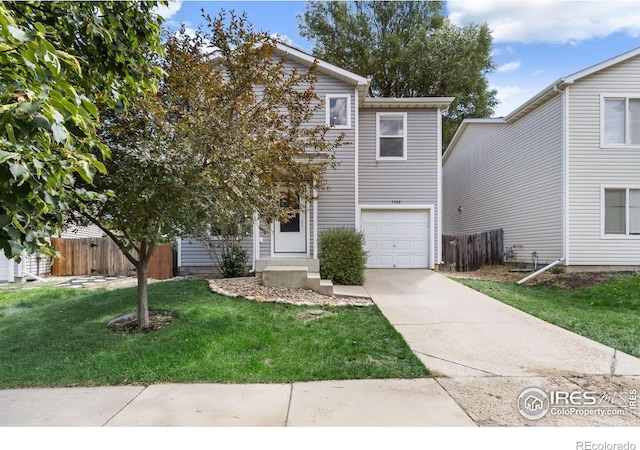 view of front facade featuring a front yard and a garage