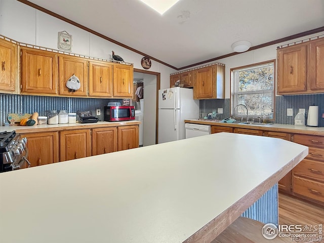 kitchen with crown molding, white appliances, lofted ceiling, decorative backsplash, and light wood-type flooring