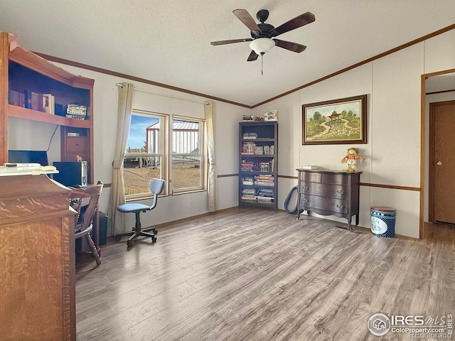 home office with hardwood / wood-style flooring, crown molding, a textured ceiling, and vaulted ceiling