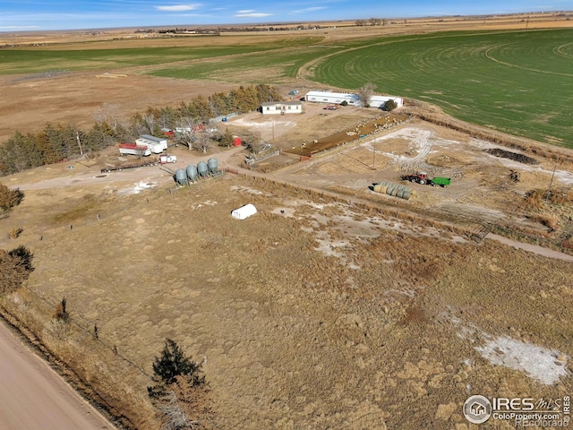 birds eye view of property with a rural view