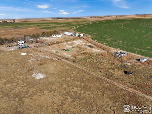 birds eye view of property with a rural view