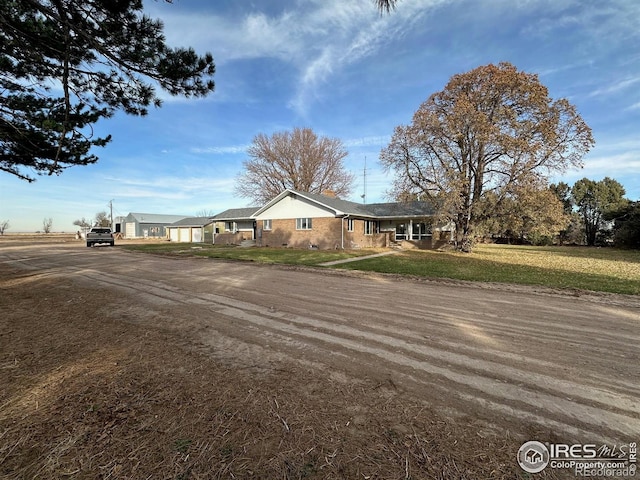 single story home featuring a front yard