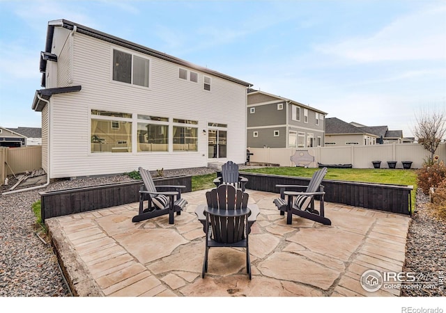 exterior space featuring a patio area and a fire pit