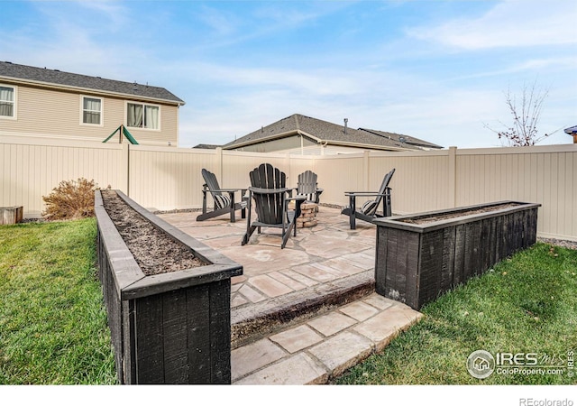 view of patio / terrace with an outdoor fire pit