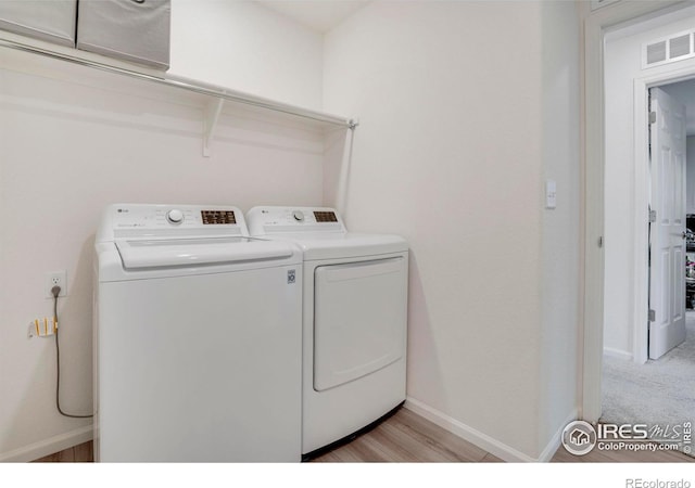 washroom with washer and clothes dryer