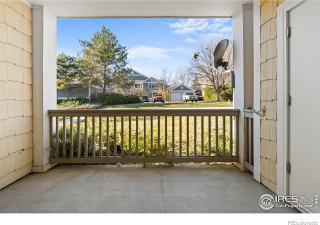 balcony with covered porch and a residential view