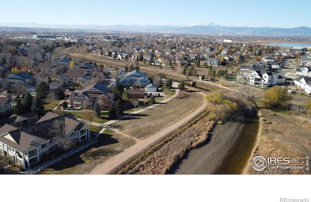 birds eye view of property featuring a mountain view and a residential view