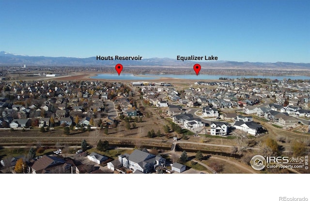 bird's eye view featuring a residential view and a water and mountain view