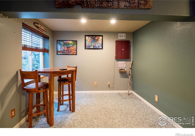 view of carpeted dining area