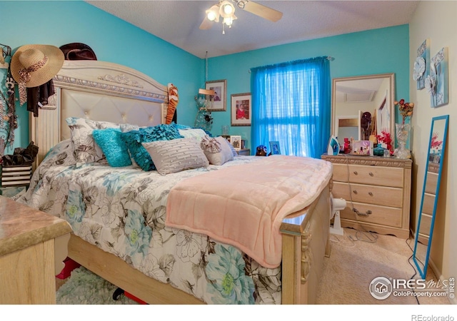 bedroom featuring ceiling fan and light carpet