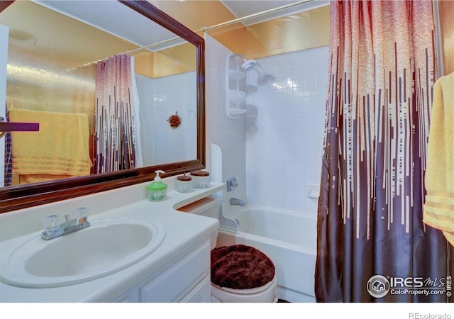 full bathroom with vanity, shower / bathtub combination with curtain, and toilet