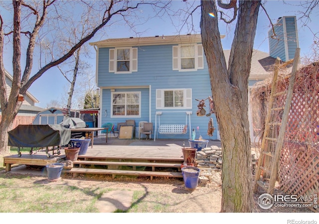 rear view of property with a deck