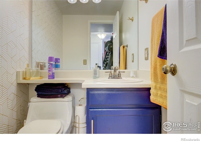 bathroom with vanity and toilet