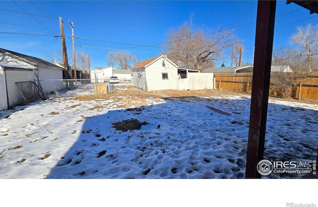 view of yard covered in snow