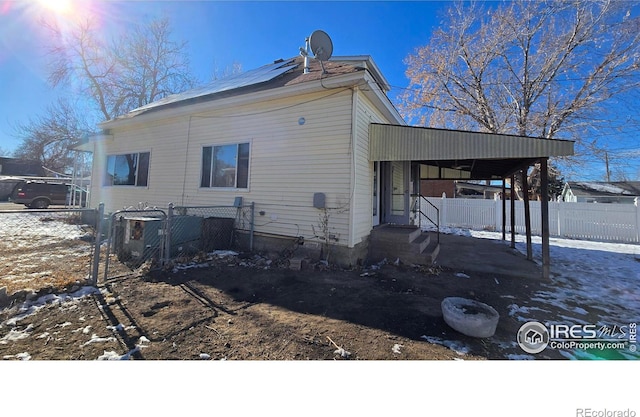 exterior space with central air condition unit and solar panels