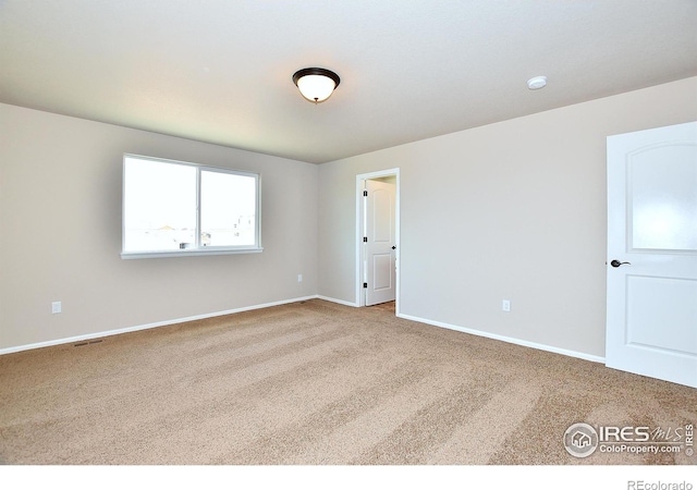 708 85th Avenue Ct, Greeley, CO 80634 - carpeted empty room featuring baseboards and a smoke detector