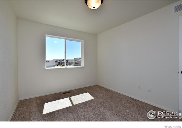 view of carpeted spare room