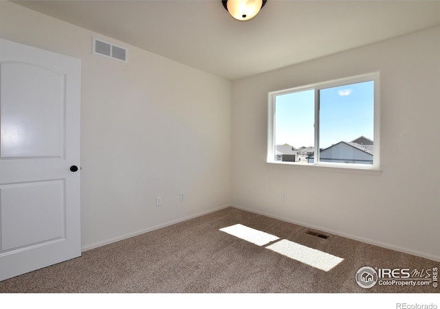 view of carpeted spare room