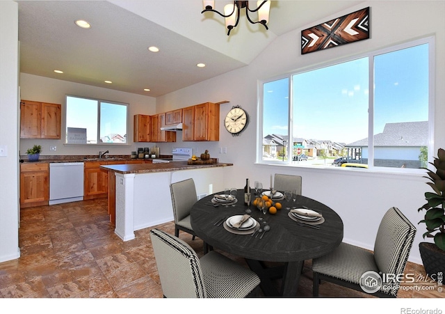 dining room with a notable chandelier and recessed lighting