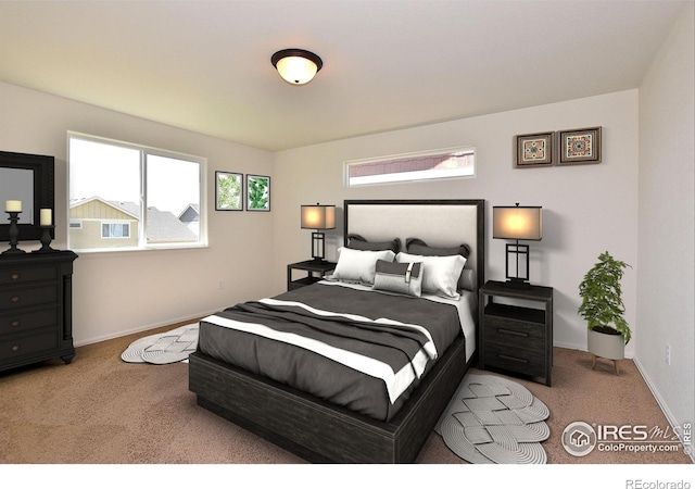 bedroom with carpet floors and baseboards