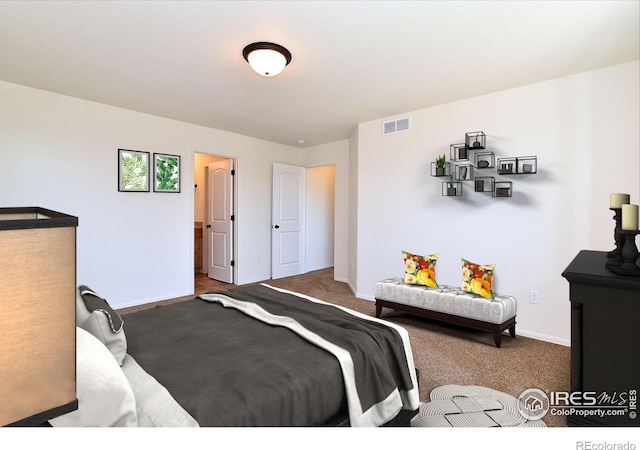 bedroom featuring carpet floors, visible vents, and baseboards