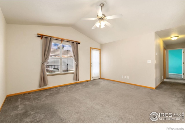 unfurnished room featuring ceiling fan, vaulted ceiling, and carpet floors