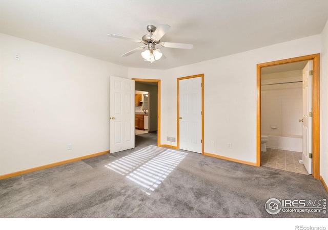 unfurnished bedroom featuring ceiling fan, connected bathroom, and light colored carpet