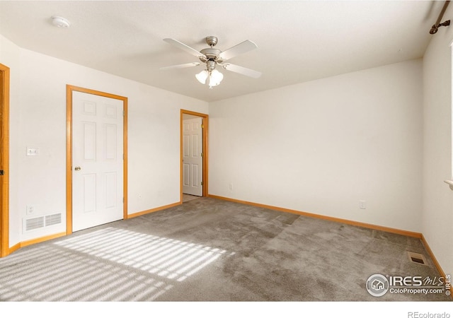 unfurnished bedroom with ceiling fan and carpet