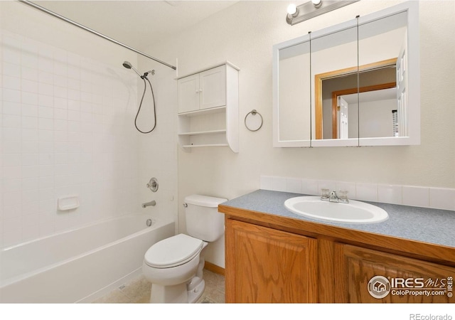 full bathroom featuring vanity, tile patterned flooring, toilet, and washtub / shower combination