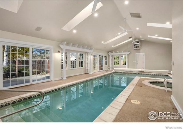 view of swimming pool with a skylight