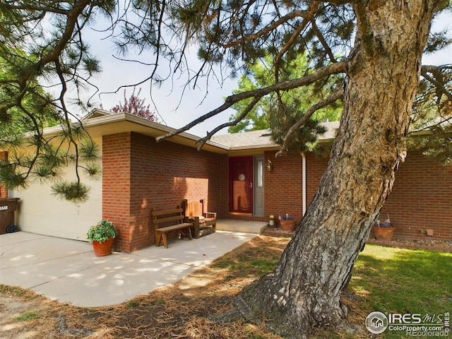 back of house with a patio