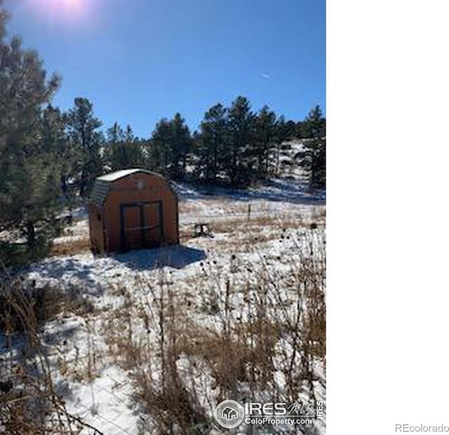 387 Lakeview Dr, Drake, CO 80515 - snow covered structure featuring a storage unit